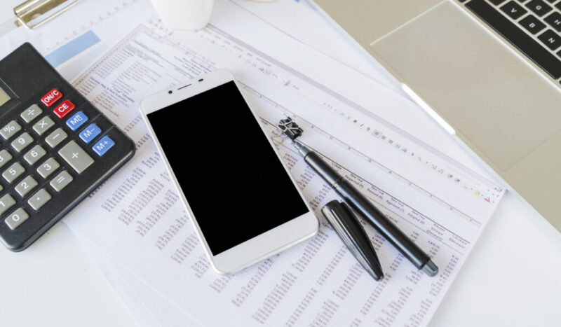 desk-office-accountant-with-calculator-smartphone
